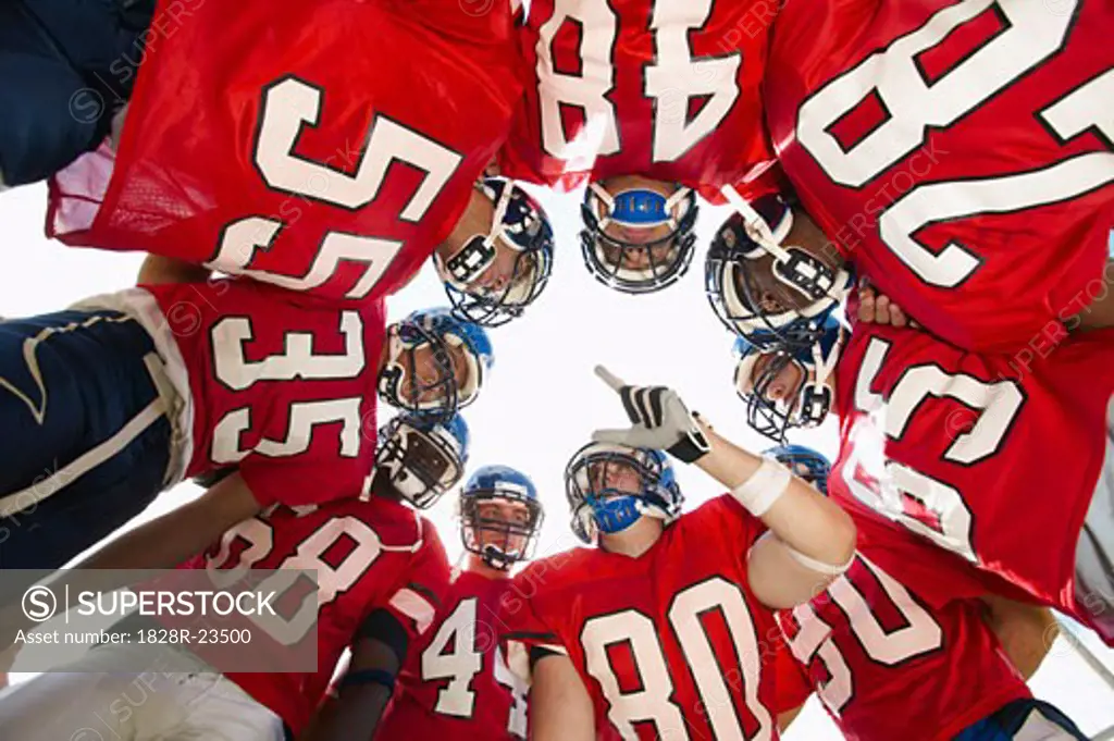 Football Players in Huddle   