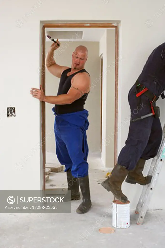 Men Painting House Interior  
