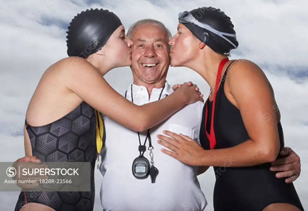 Swimmers Kissing Coach   