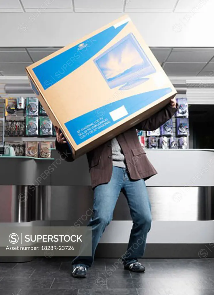 Man Carrying Large Television Box   