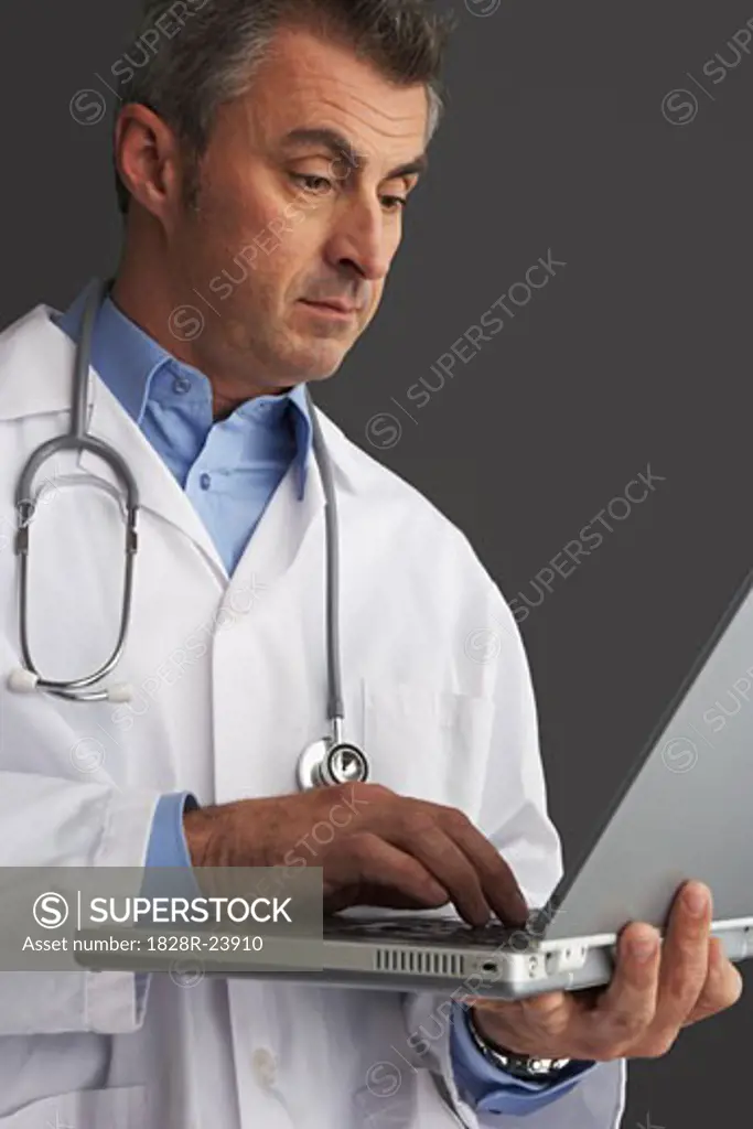 Doctor using Laptop Computer   