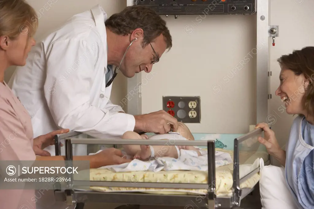 Doctor Examining Newborn   