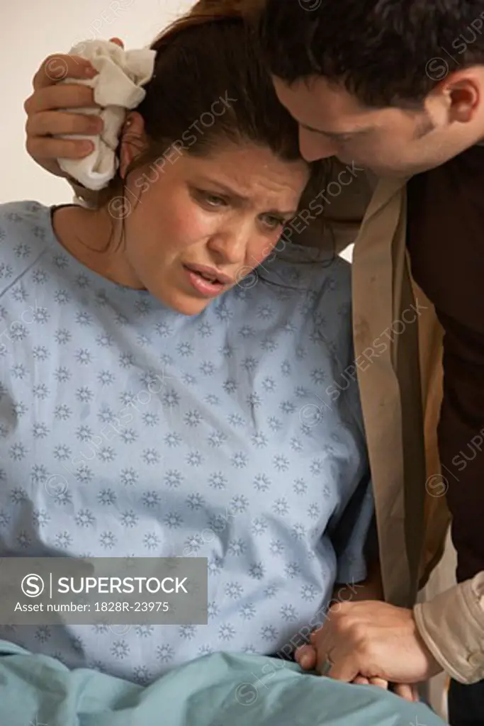 Husband Helping Wife Through Contractions   