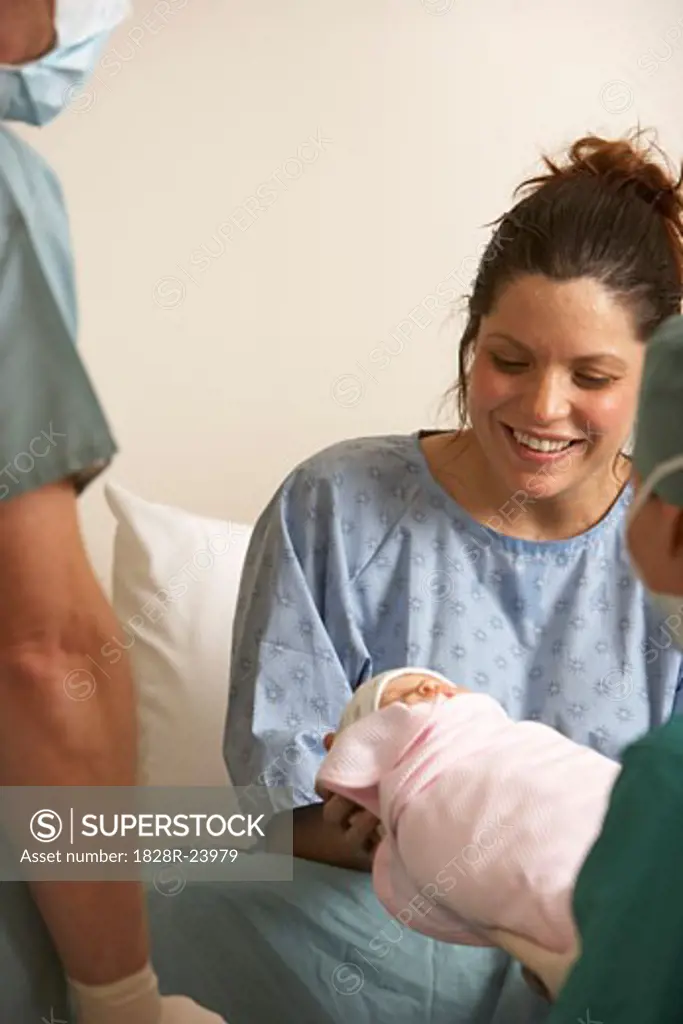Woman Holding Newborn   