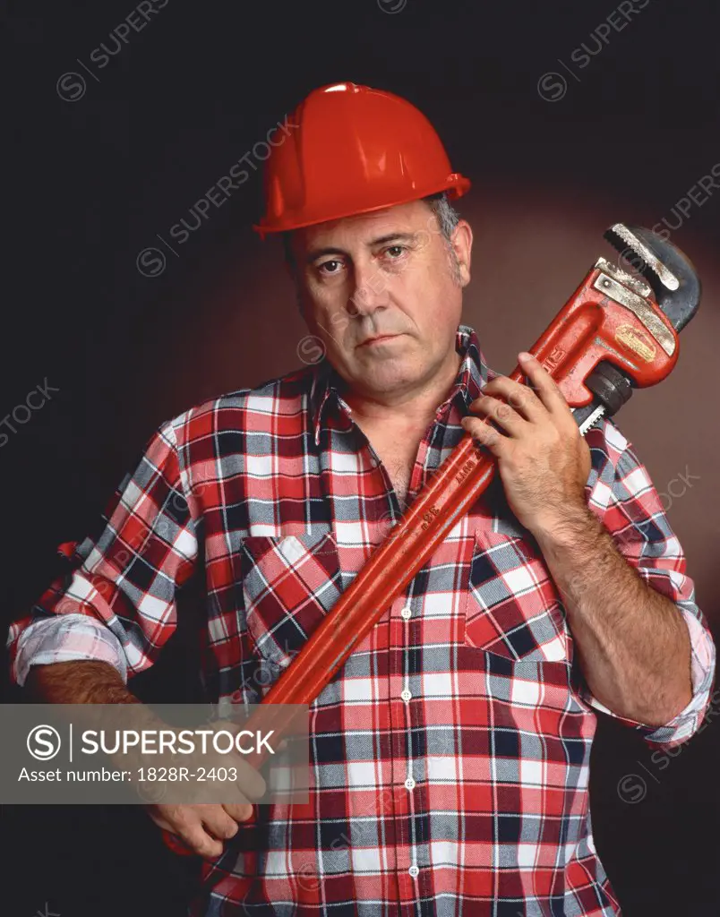 Portrait of Male Worker Holding Wrench   