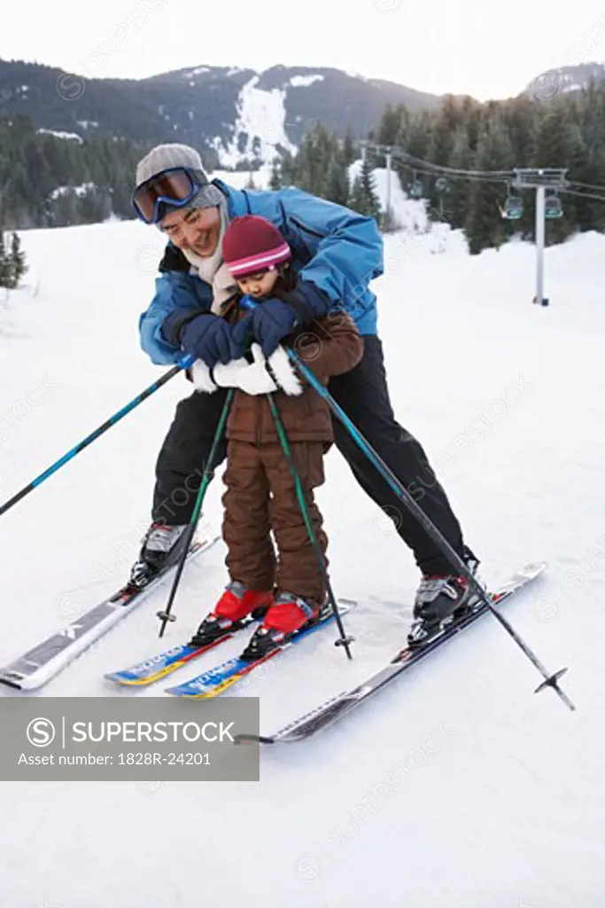 Father and Daughter on Ski Hill, Whistler, British Columbia, Canada   