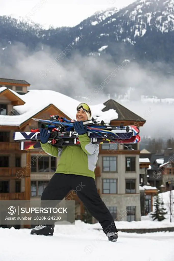 Man Carrying Skis, Whistler, British Columbia, Canada   