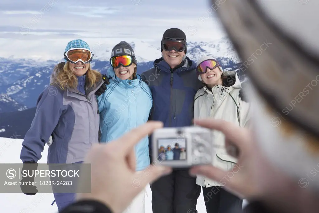 Person Taking Picture of Friends On Ski Hill, Whistler, BC, Canada   