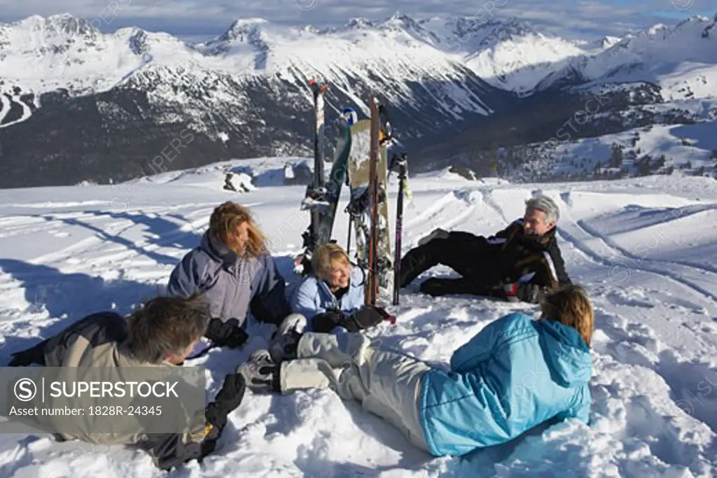 Group of People Relaxing at Top of Ski Hill, Whistler, BC, Canada   