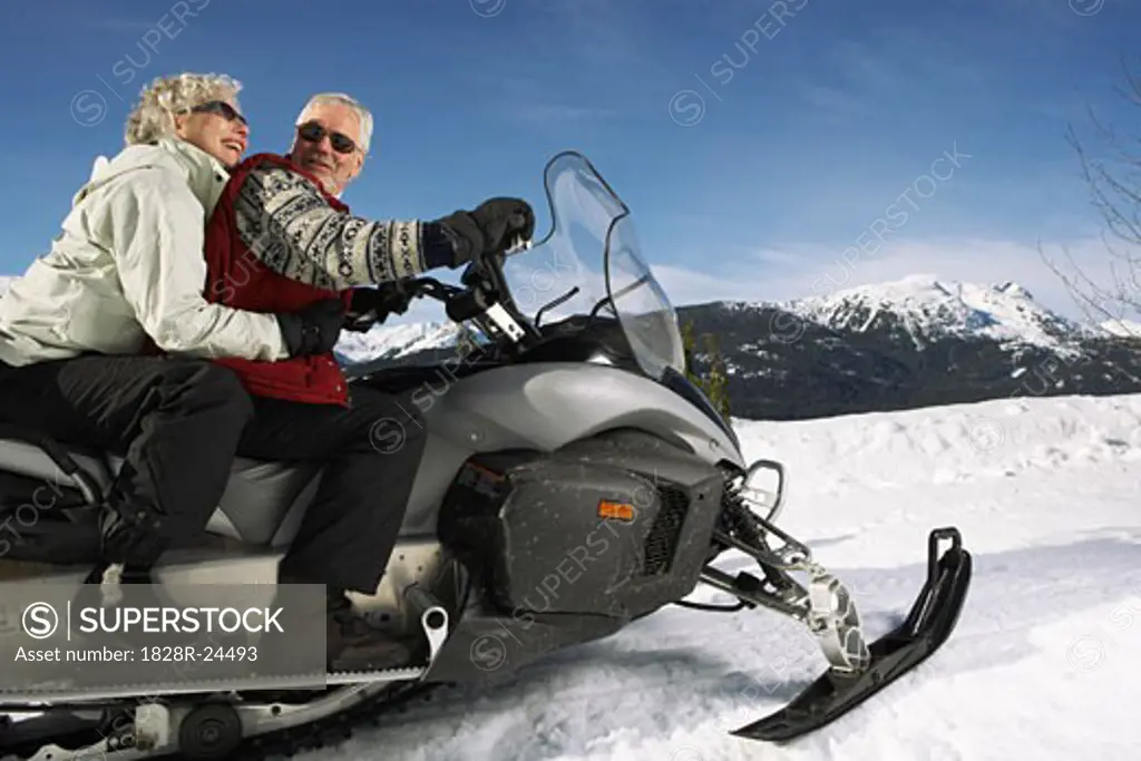 Couple Snowmobiling   