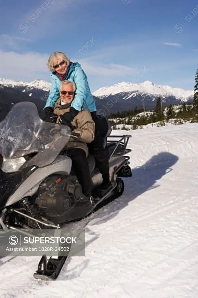 Couple Snowmobiling   