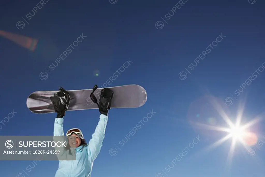 Portrait of Woman Holding Snowboard   