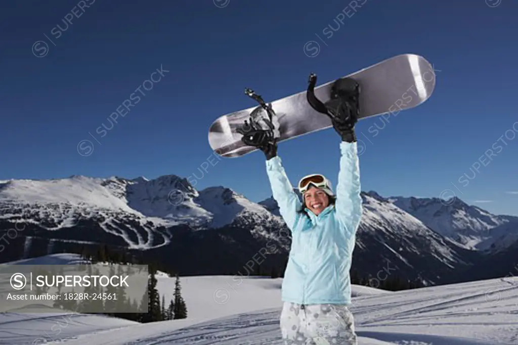 Portrait of Woman Holding Snowboard   