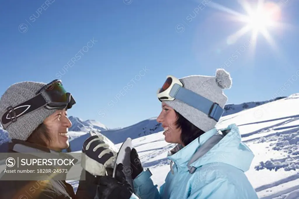 Couple Snowboarding   
