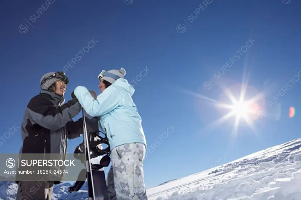 Couple Snowboarding   