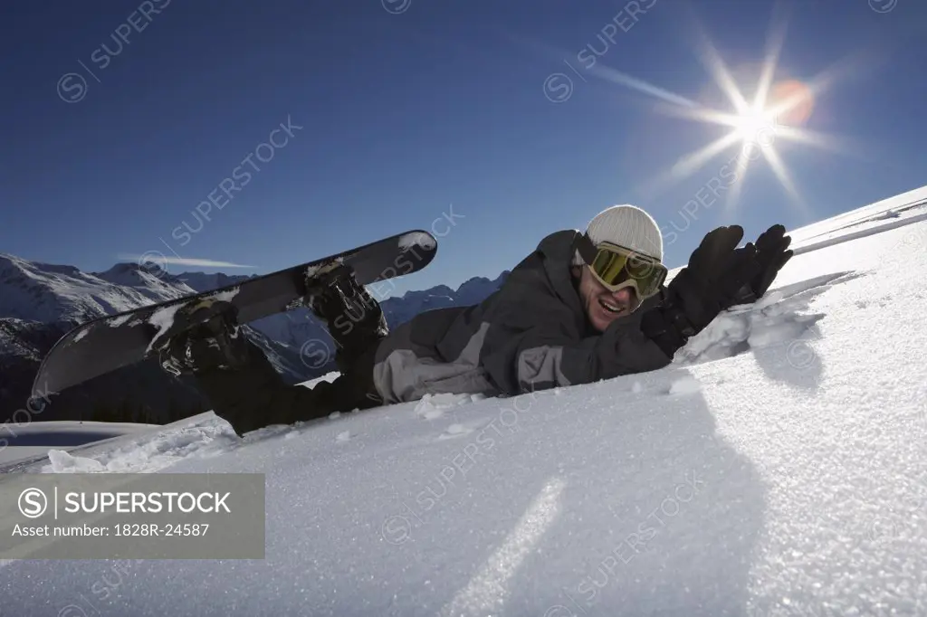 Man Falling Off Snowboard   