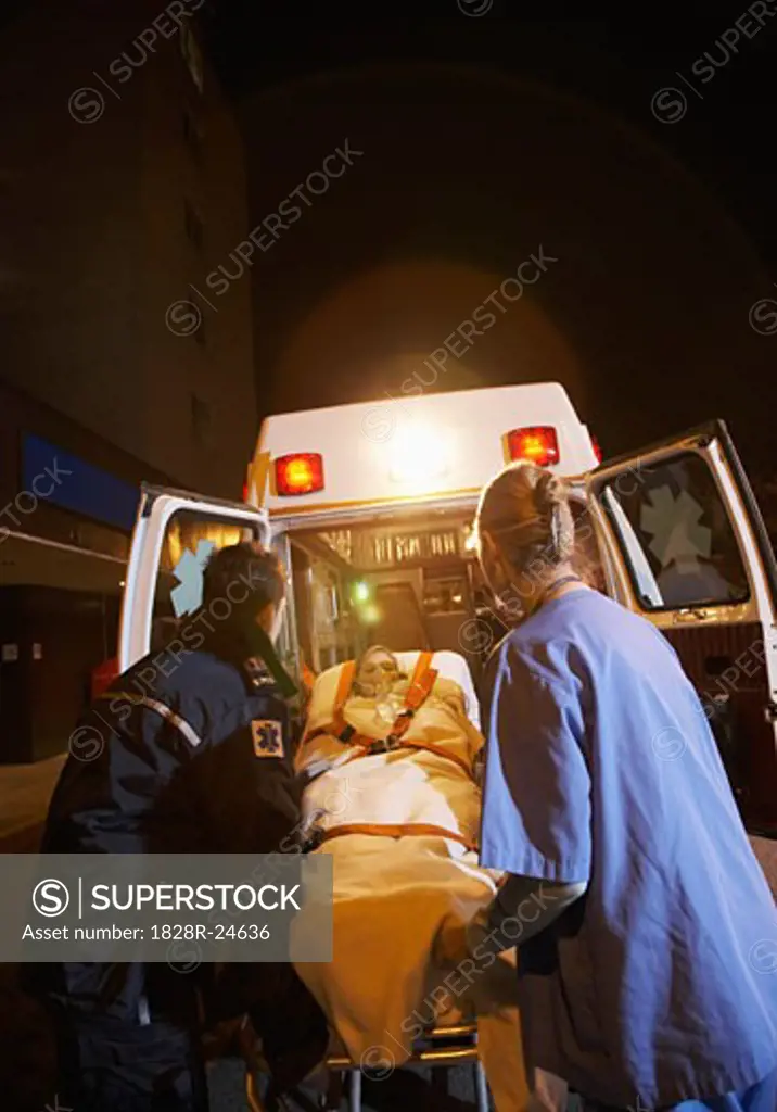 Paramedic and Doctor Removing Patient from Ambulance   
