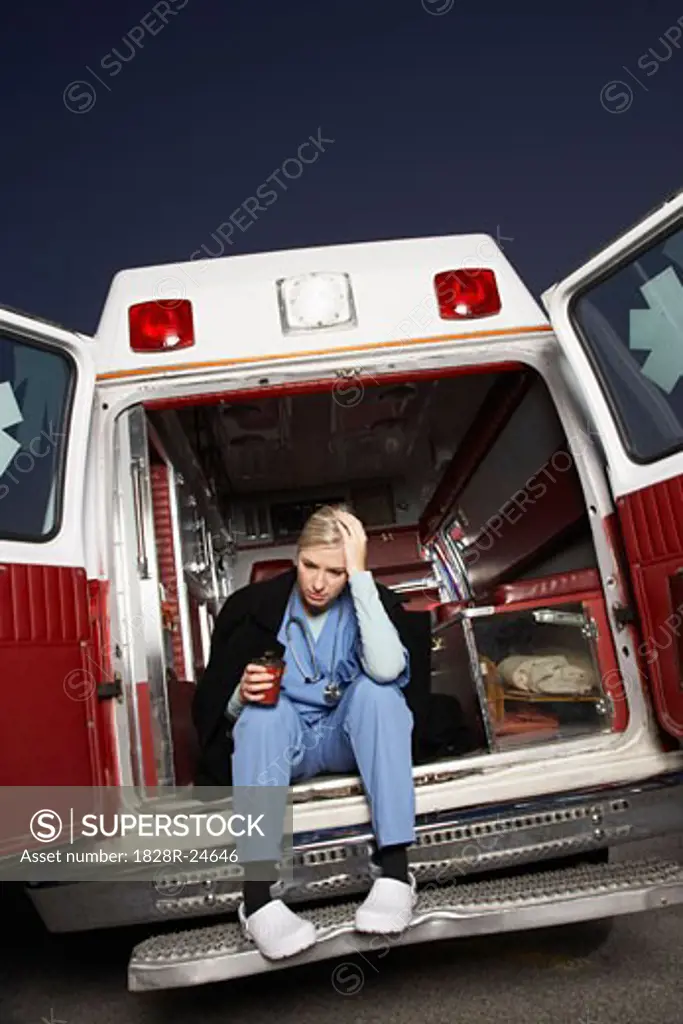 Doctor Sitting in the Back of Ambulance   