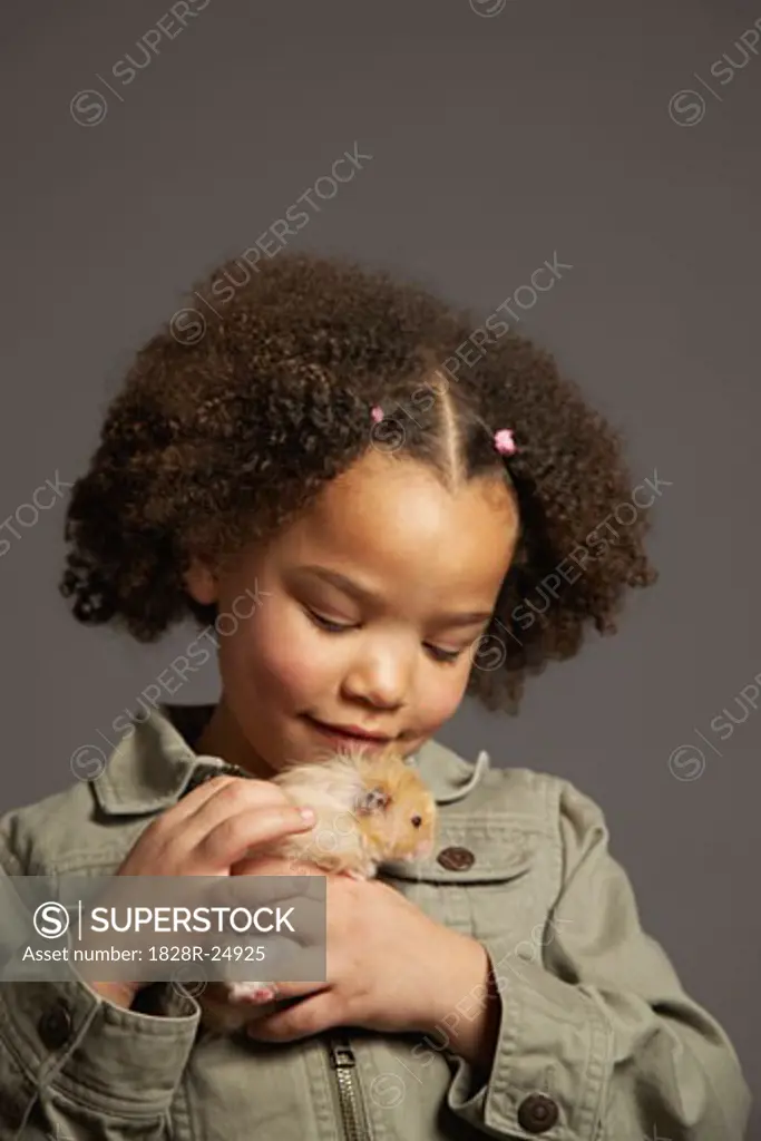 Girl Petting Hamster   