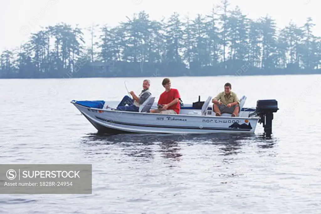 Man and Teenagers Fishing, Belgrade Lakes, Maine, USA   