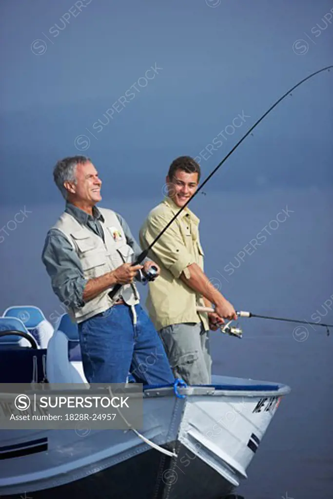 Man and Teenager Fishing, Belgrade Lakes, Maine, USA   