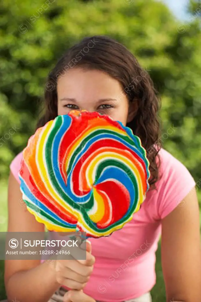 Teenage Girl Holding Lollipop   