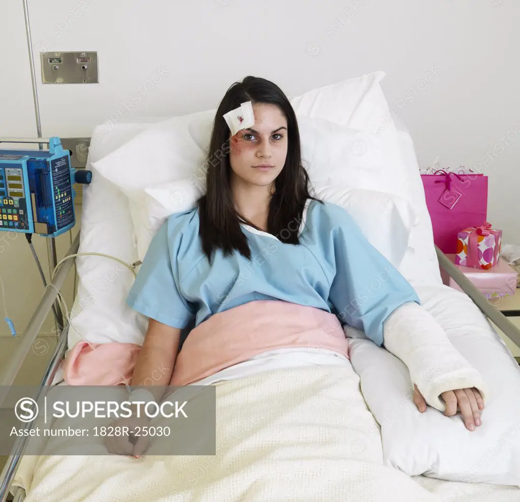 Woman in Hospital Room with Injuries   