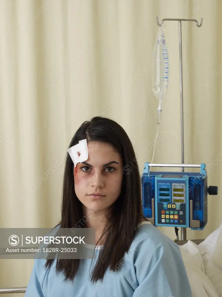 Woman in Hospital Room with Injuries   