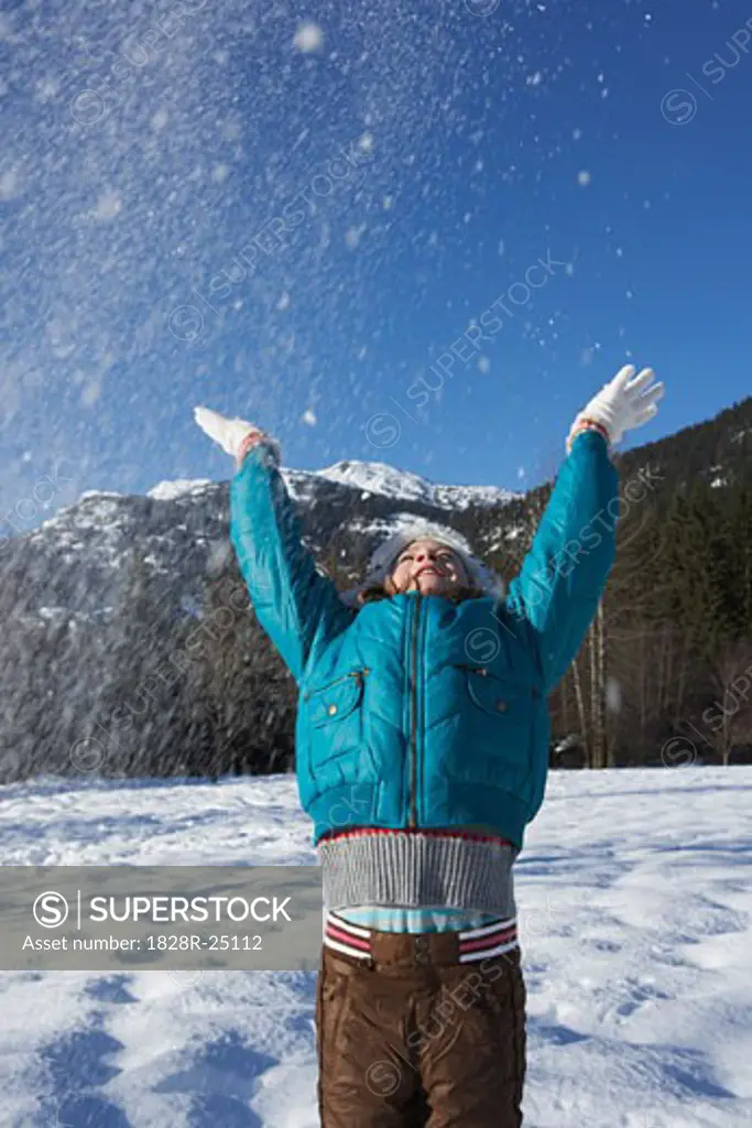 Girl Throwing Snow into Air   
