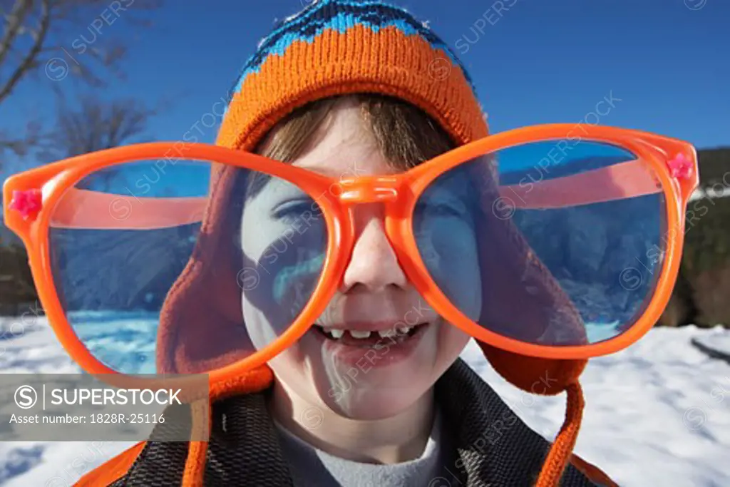 Boy Wearing Over-sized Sunglasses   