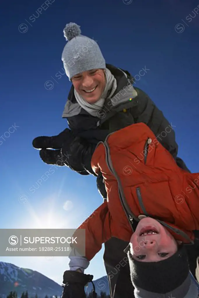 Father Lifting Son   