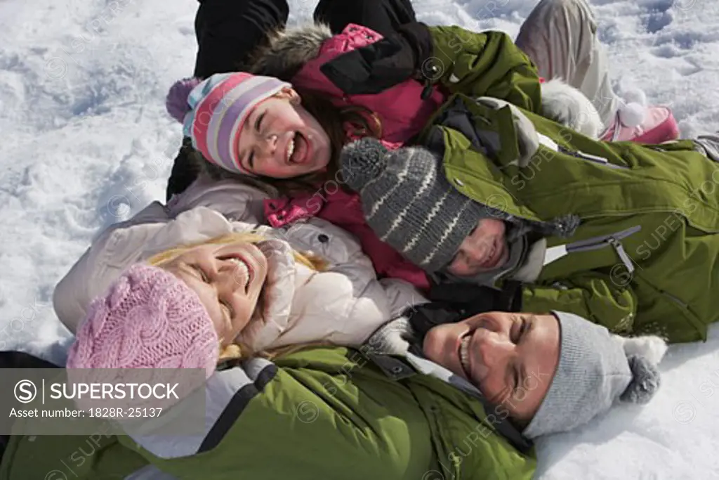 Family Lying on Snow   