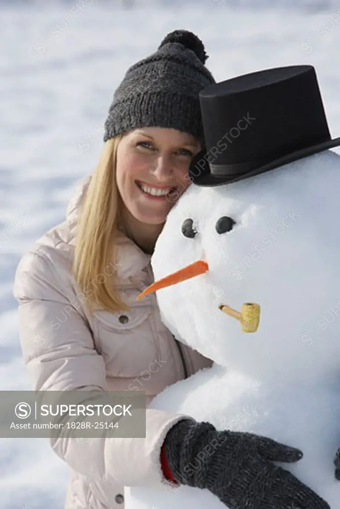 Woman Hugging Snowman   