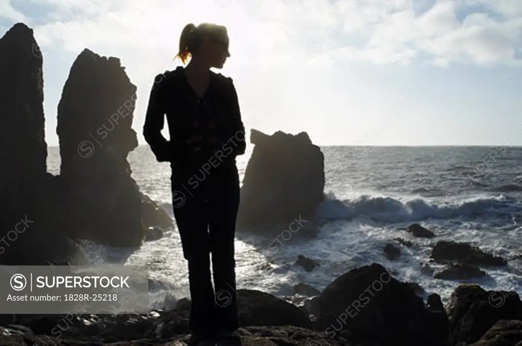 Woman Standing on Rocks at Humboldt Coast, California, USA   