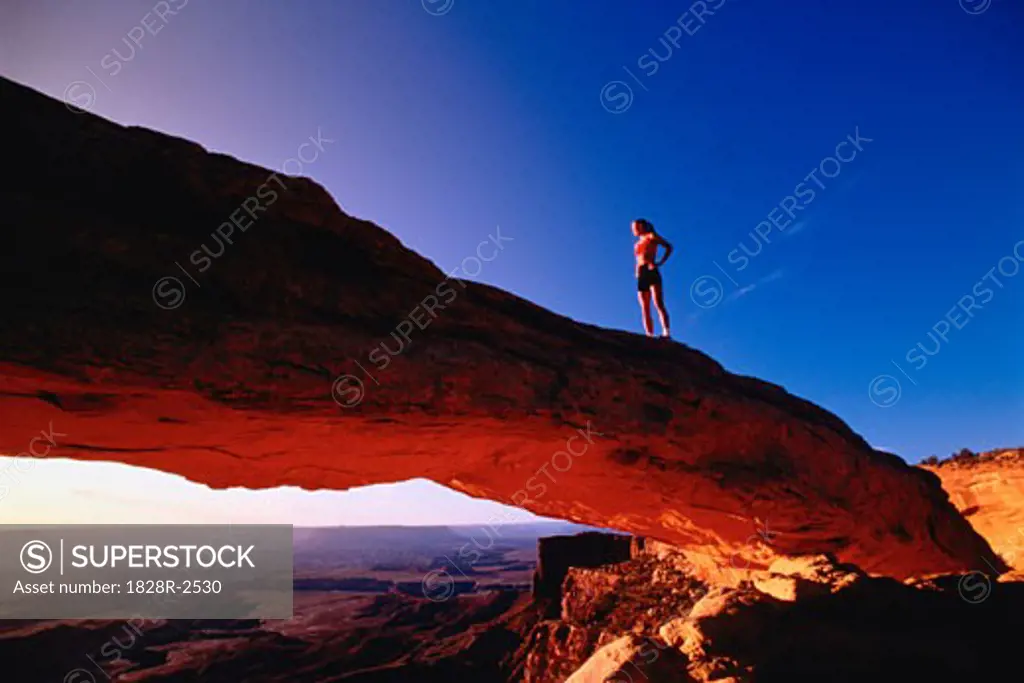 Woman Standing on Rock   