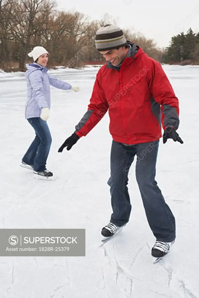 Woman with Man Learning to Skate   
