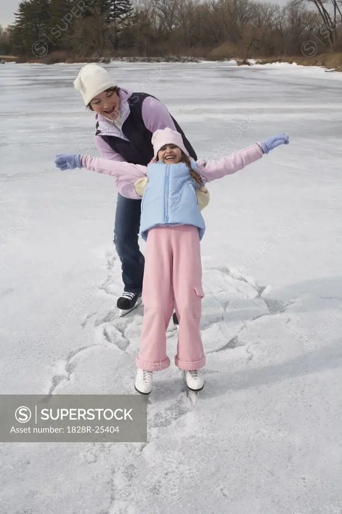 Mother Catching Daughter while Skating   