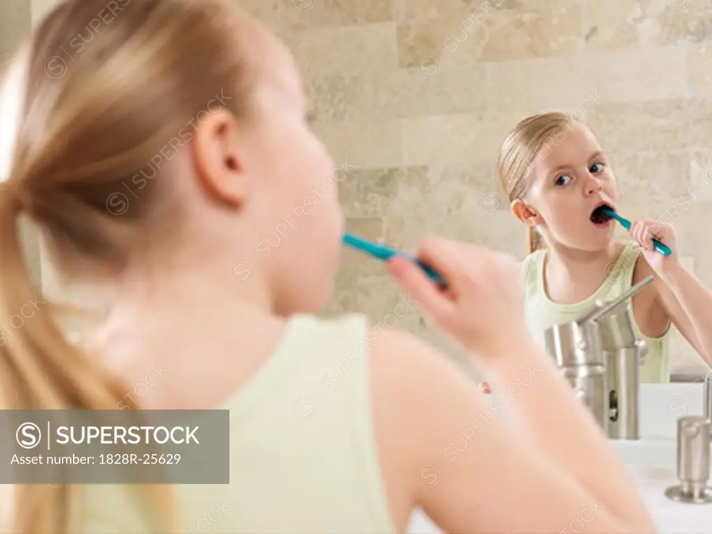 Girl Brushing Her Teeth   