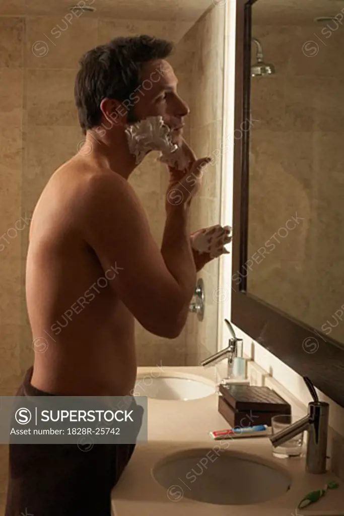 Man Shaving in Bathroom   