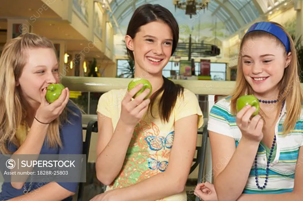 Teenagers Eating Apples   