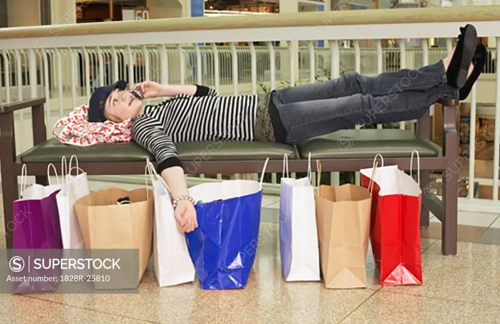 Teenager on Cell Phone at Mall   