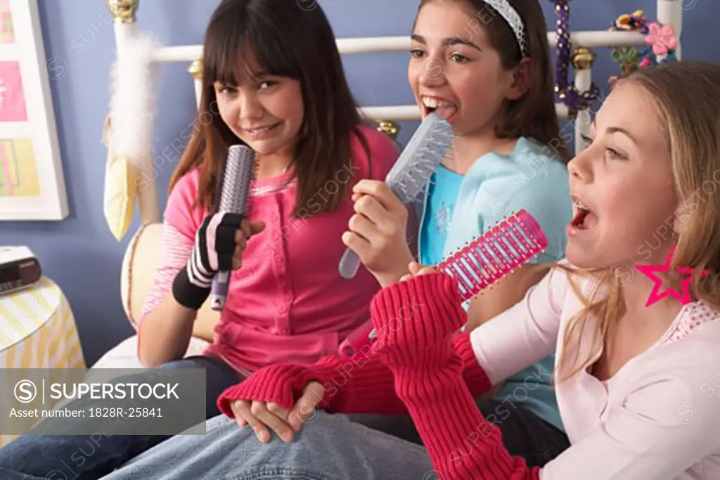 Girls Singing into Hairbrushes   