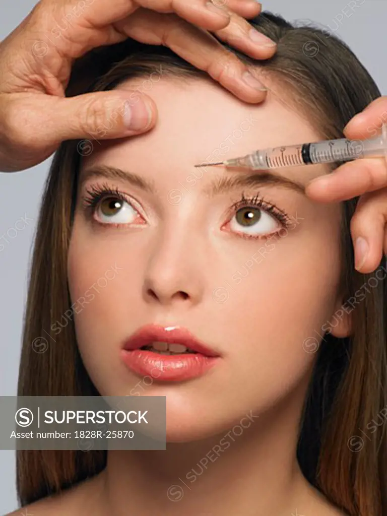 Young Woman Getting Botox Injection   