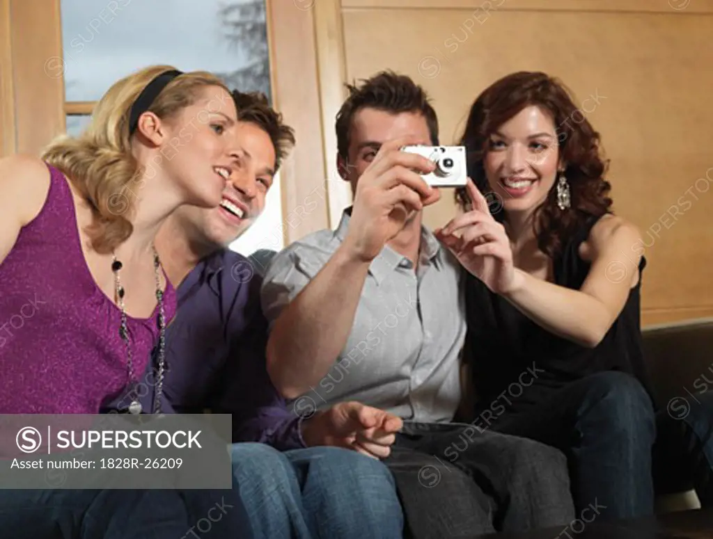 Group of People Using Digital Camera   