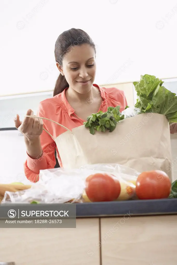 Woman Unpacking Groceries   