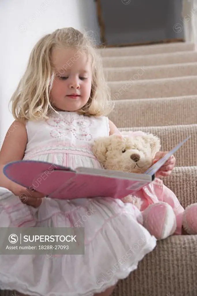 Girl Reading Book on Staircase   