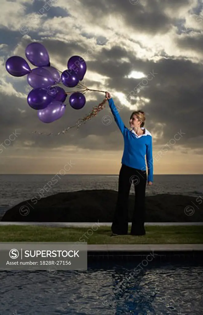 Woman Holding Balloons   