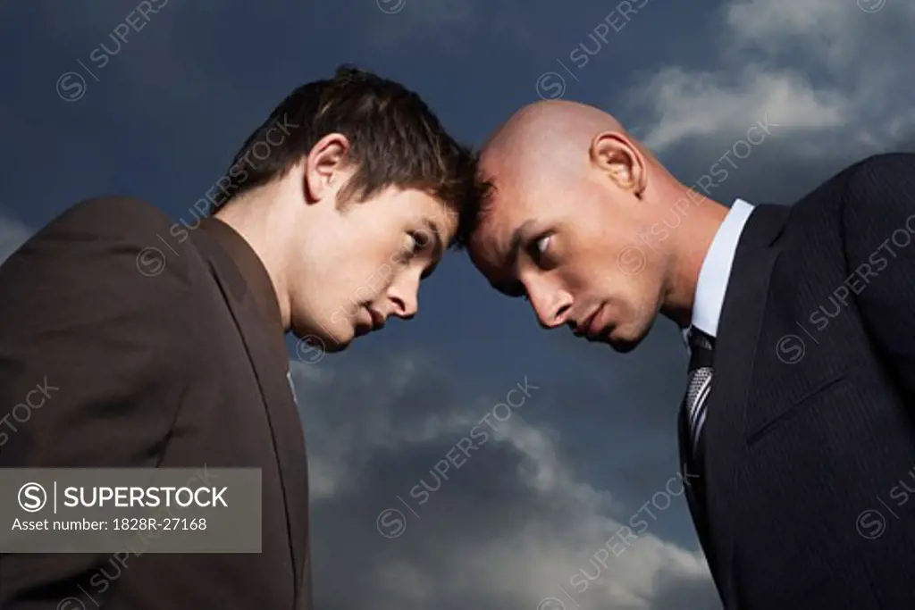 Businessmen Butting Heads   