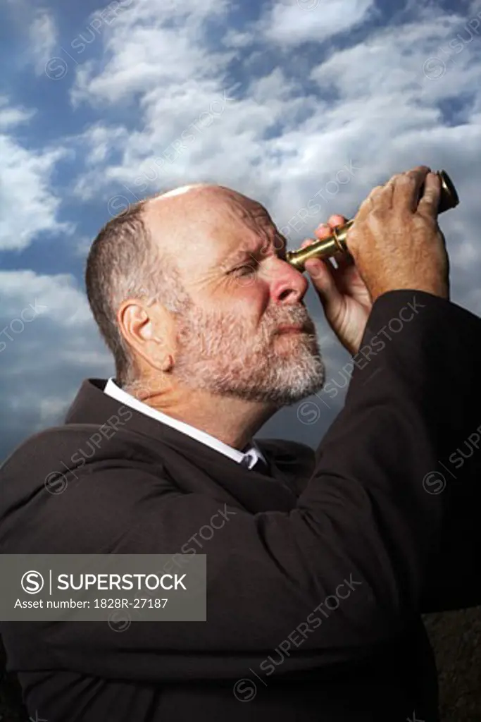 Businessman Using Telescope   