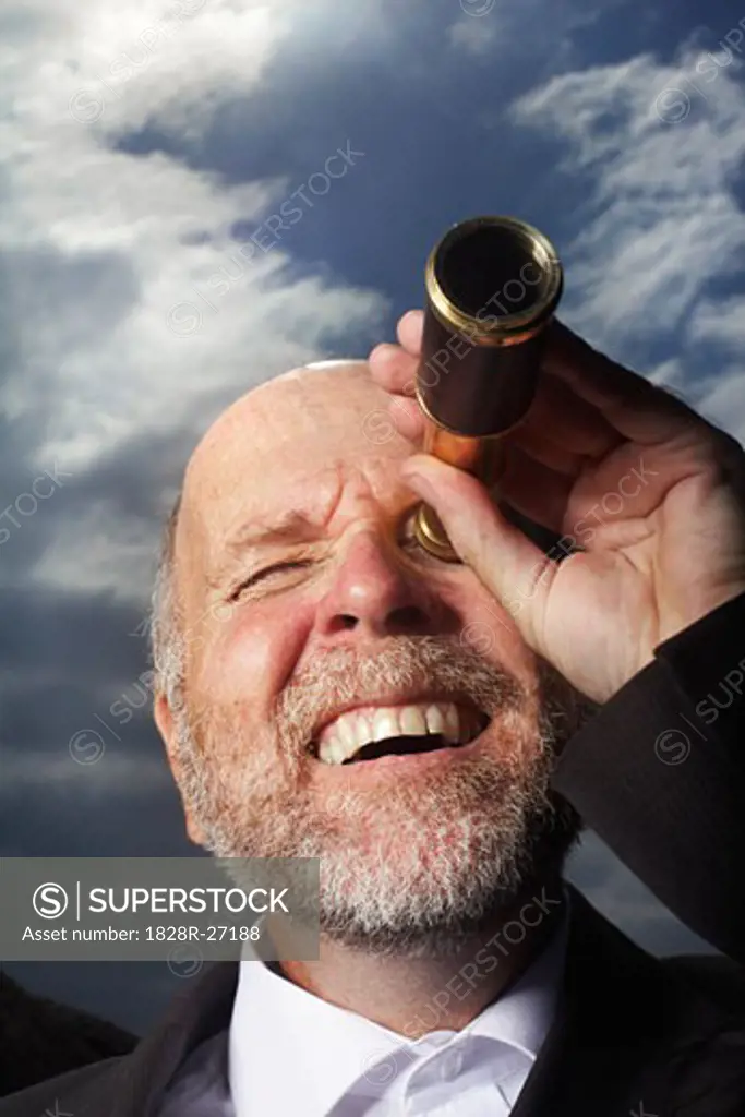 Businessman Using Telescope   